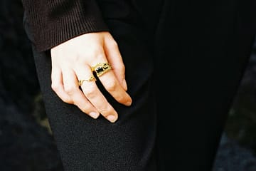 a woman's hand with a ring on it